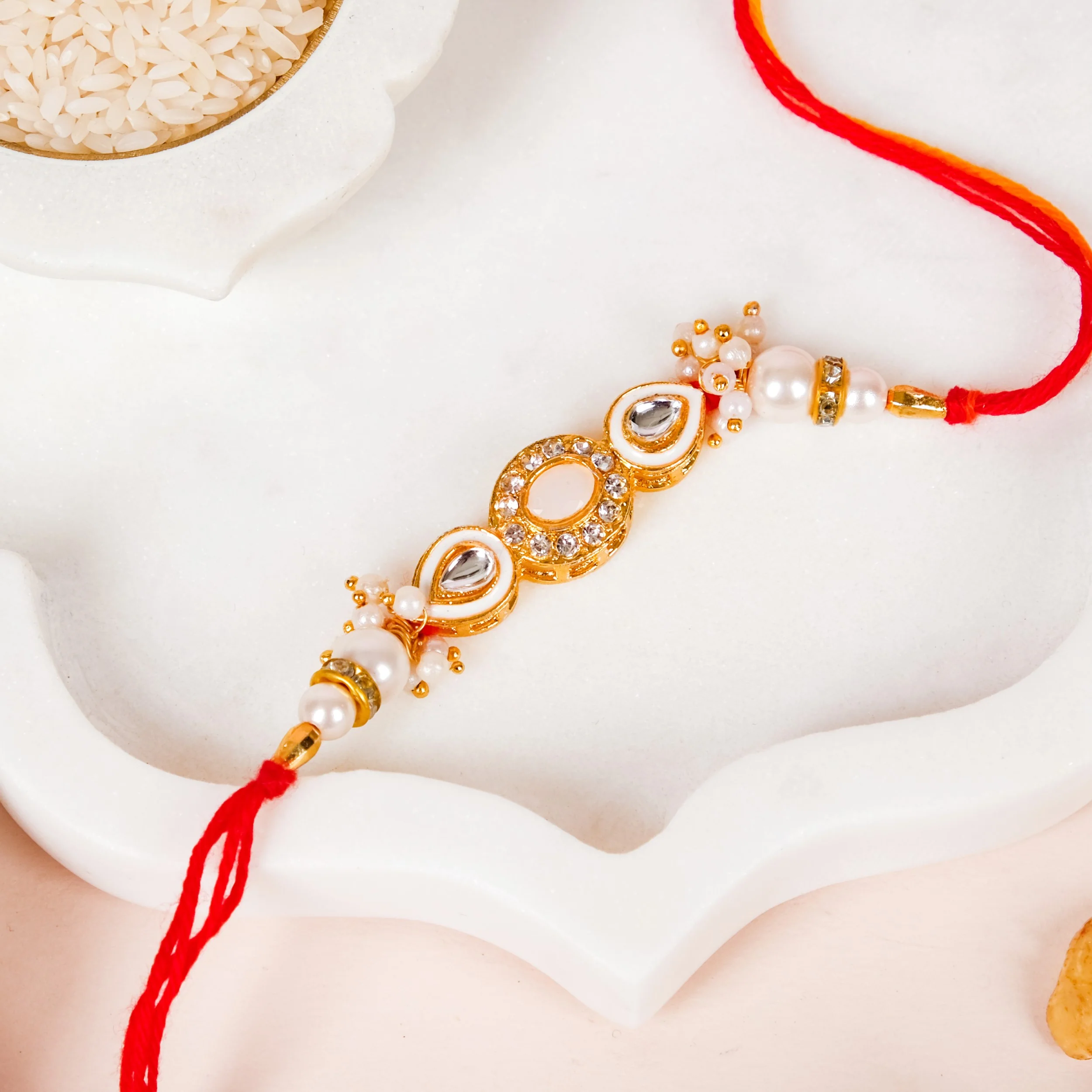 Stone And Pearl White Kundan Rakhi Set For Couple - Image 7